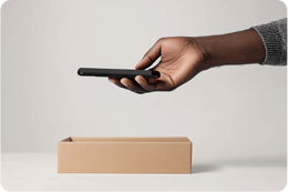 image of mobile being placed in a box ES