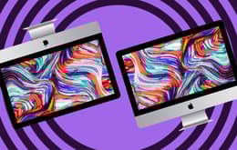 An image of Apple iMacs with abstract screens.